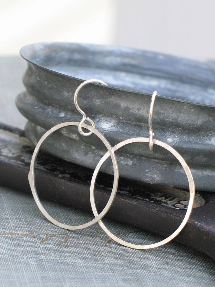 Medium Silver Hoops: Handcrafted from sterling silver, these hoops add a touch of elegance to any outfit, because who said your ears shouldn't have a good time?
