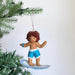Felt Surfer Boy Ornament in white, celebrating summer vibes with a cheerful expression, perfect for holiday decor.