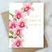 Floral card showcasing pink orchids with gold accents, celebrating new motherhood, by Abigail Jayne Design, part of the Abigail Jayne Card Collection.