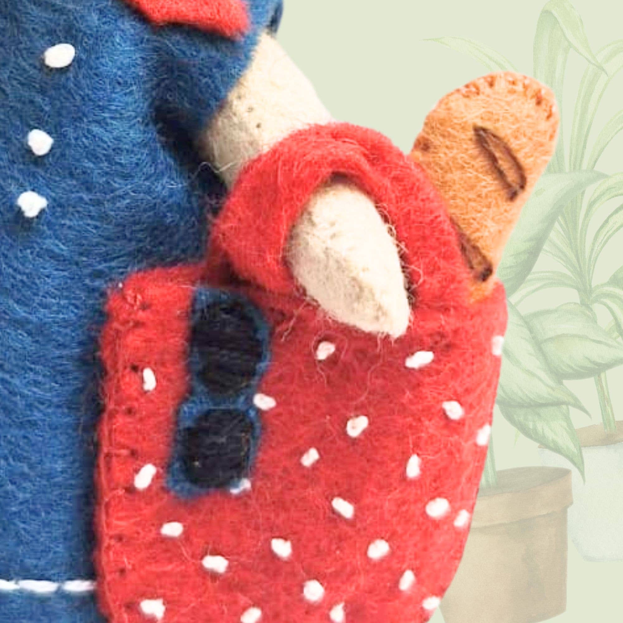 Little Mouse in Paris Felt Craft Mini Kit showing off her adorable vintage-style outfit while posing in front of the Eiffel Tower.