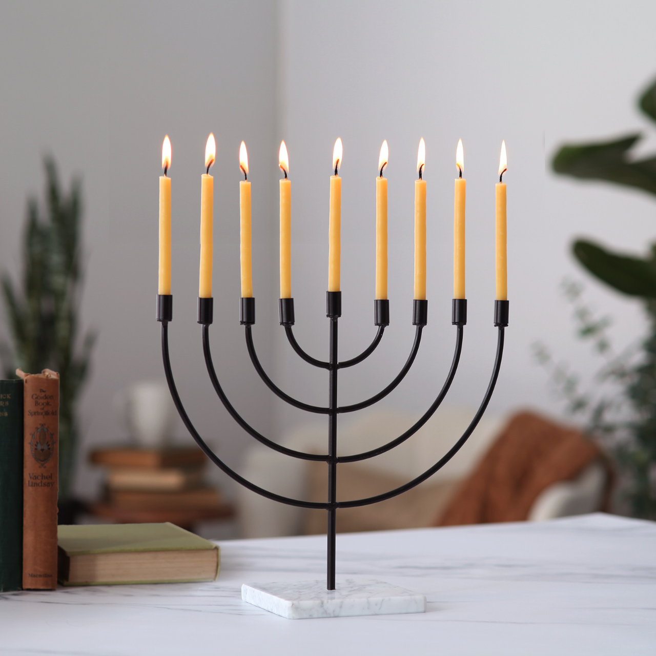 Black menorah with lit candles