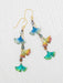 Ginkgo Chime Earrings by Holly Yashi featuring vibrant blue, green, and gold niobium leaves, perfect for adding a splash of color and whimsical movement to your outfit—because why should your ears miss out on the fun?