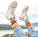 A close-up view of the Cosmos Crew Socks showcasing the bright patterns and cozy texture that bring energy to any outfit.