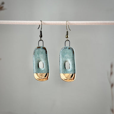 Close-up view of Turquoise Gold Dipped Abstract Hoop Ceramic Earrings - because your ears deserve a taste of elegance without the stuffy brunch!
