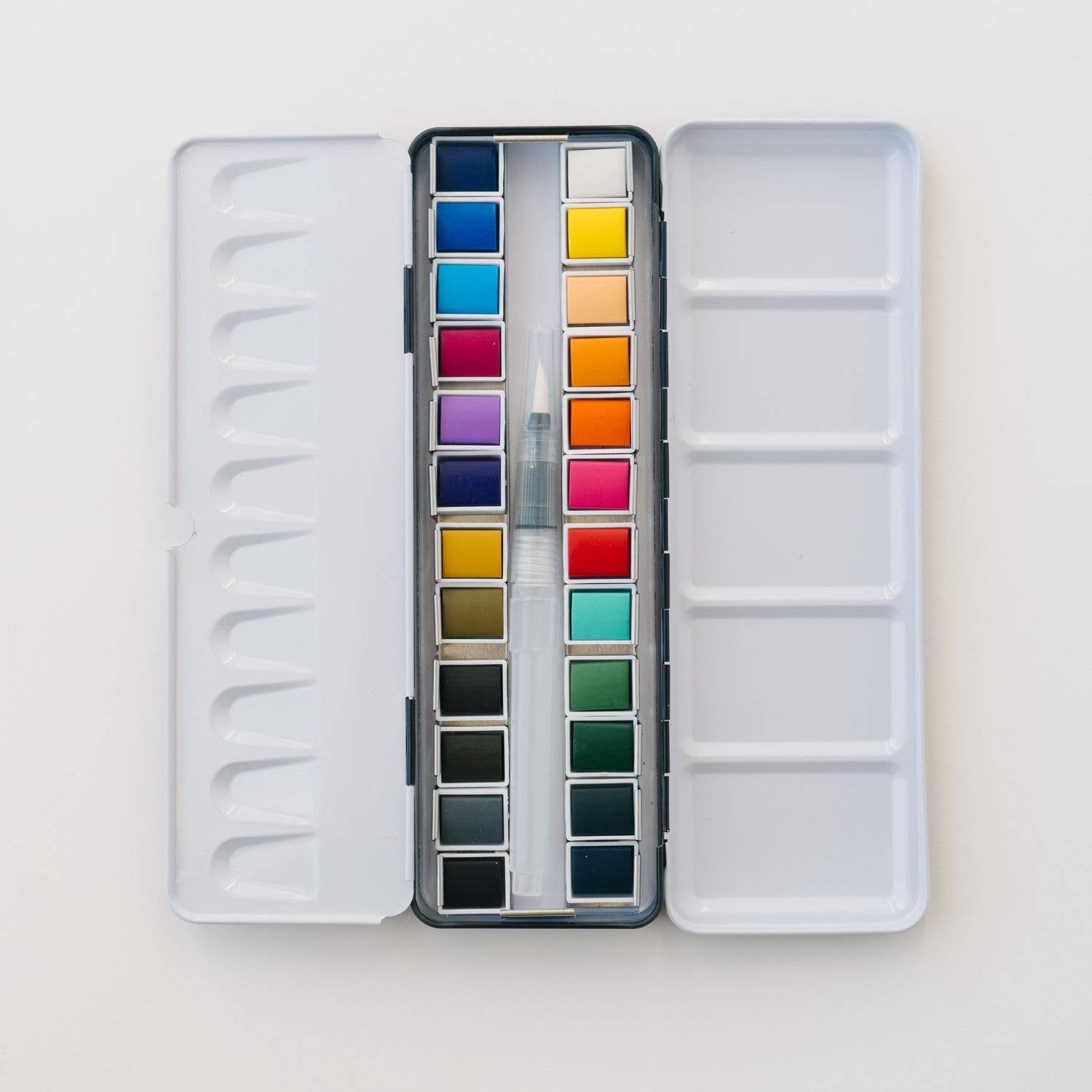 24 Color Watercolor Paint Palette displayed in a lightweight metal tin for easy travel and convenience, perfect for artists of all skill levels.