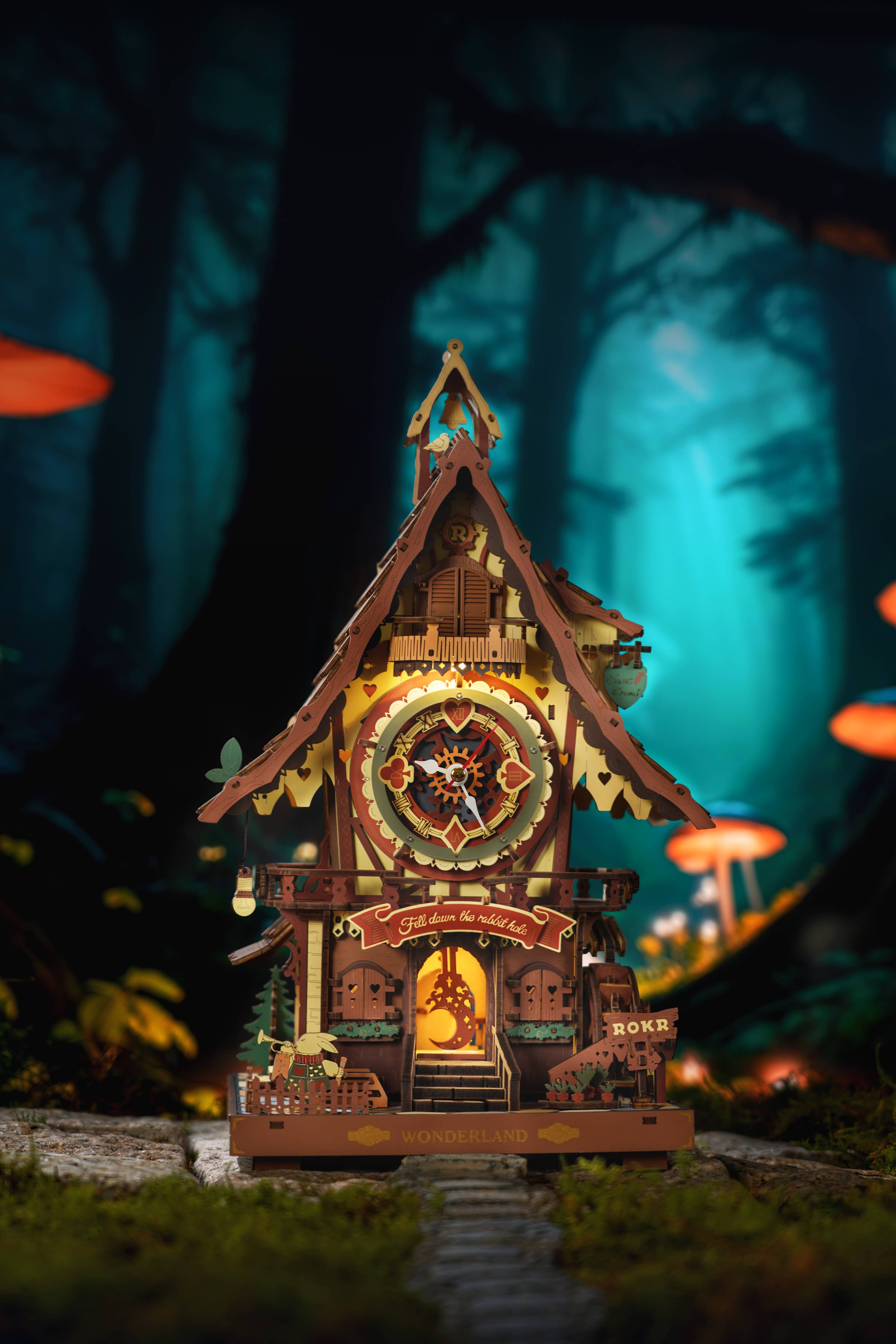 Cuckoo Clock DIY Wooden Puzzle by Hands Craft, presenting a frontal view of the decorative clock with vibrant colors and enchanting details, set against a magical forest with glowing elements.