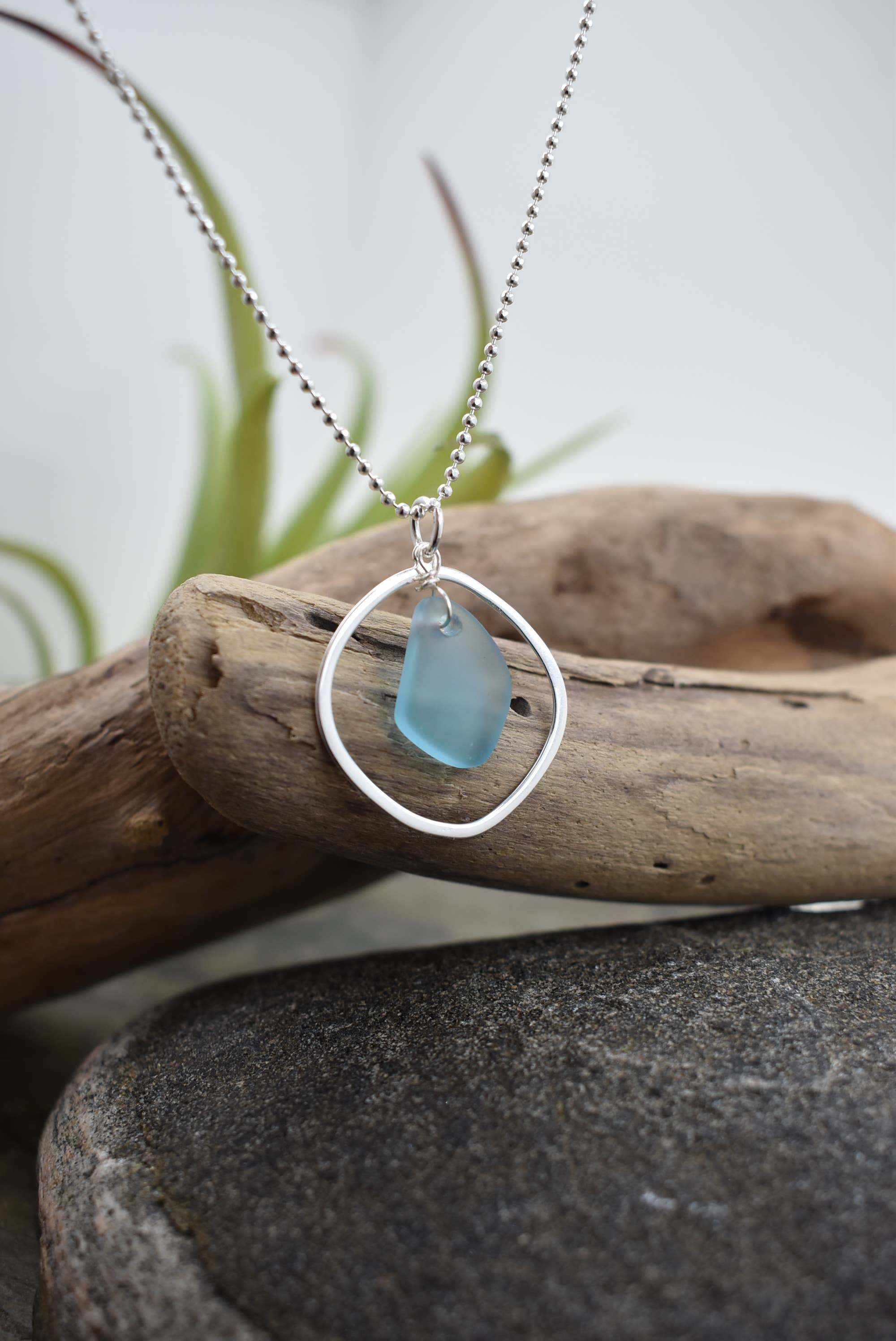 Silver pendant necklace with blue sea glass