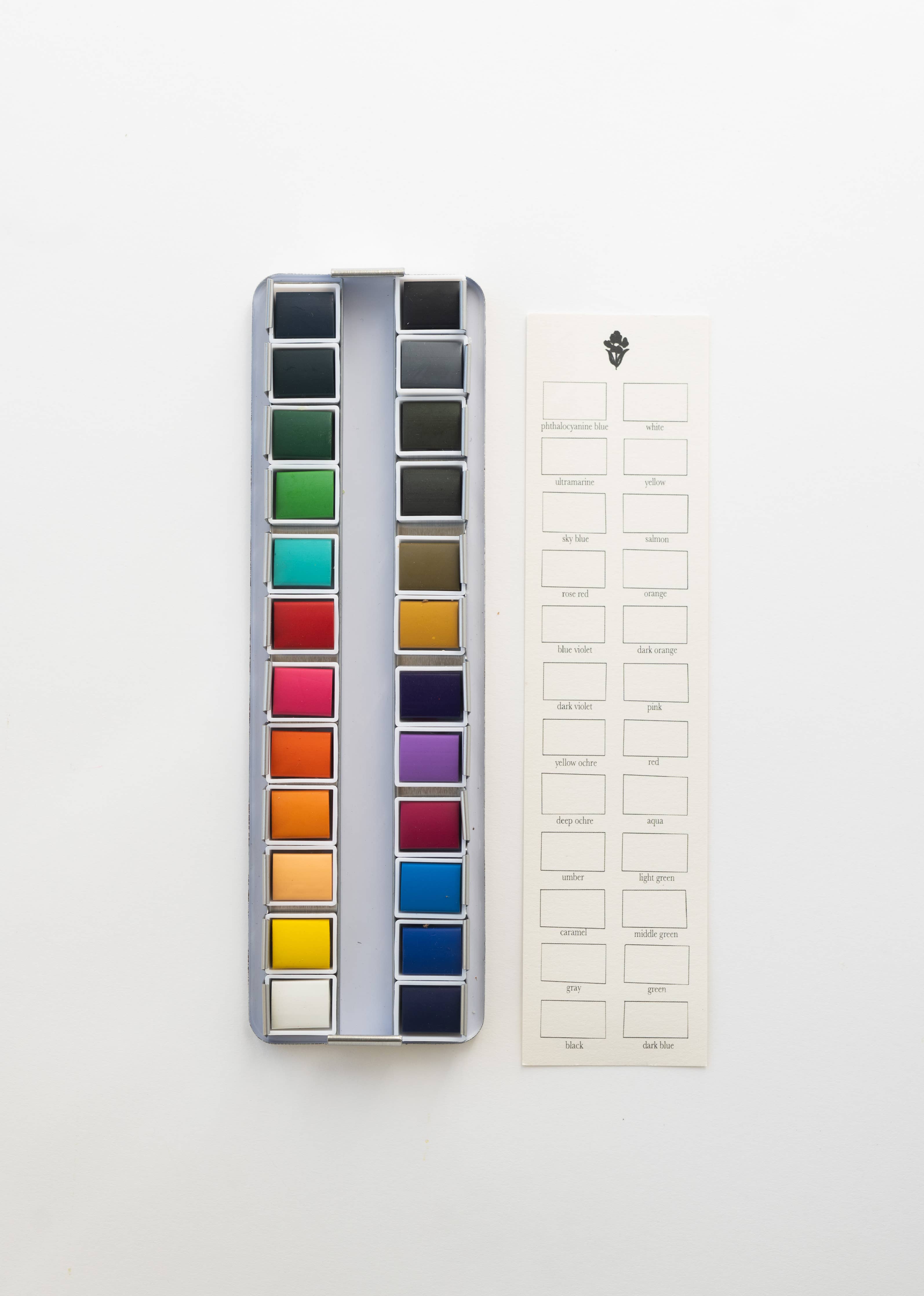 Close-up of the 24 Color Watercolor Paint Palette showing vibrant and richly pigmented colors ideal for blending and layering in various artistic projects.