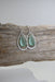 Close-up of Organic Eco glass earrings PERIWINKLE, featuring delicate open teardrop hoops made from .925 sterling silver.