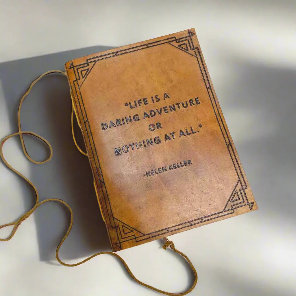 Handmade Leather Quote Journals | 5" x 7" displaying the irresistible cotton fiber paper, ready for you to doodle your way to creativity or to capture your profound quotes that will confuse future generations!