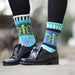 Ocean Crew Socks showcasing a beautiful pattern with Navy blue highlights, part of the Give Back Collection.