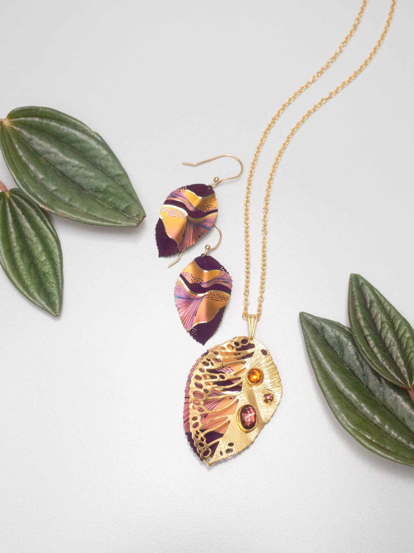 Close-up of the Eccentric Elm Earrings featuring 18K gold-plating and a stunning leaf design that could make Mother Nature weep tears of joy!