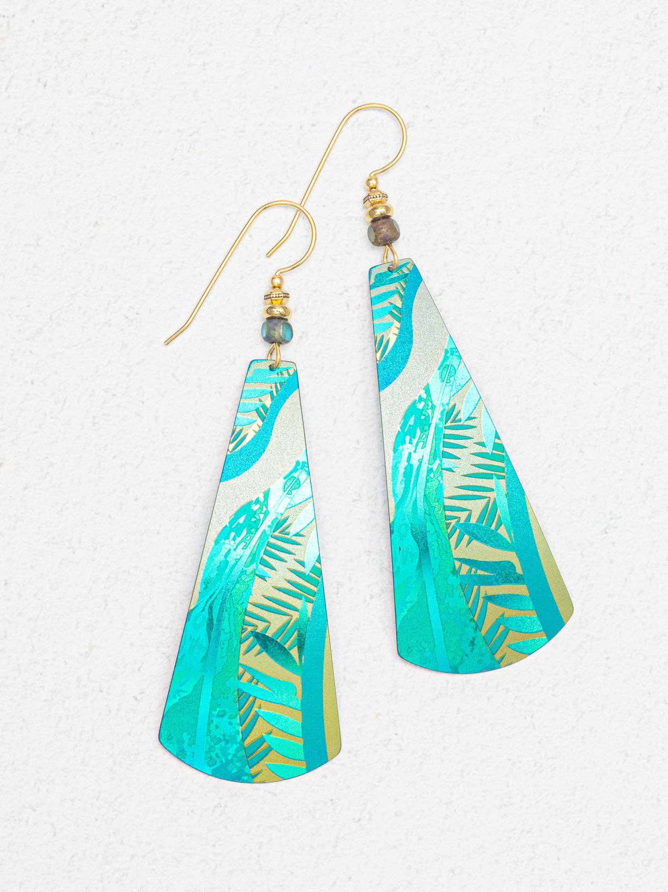 Gaya Earrings by Holly Yashi: Dangle earrings that measure 3 inches in length and 7/8 inches in width, this niobium beauty flaunts a striking green hue and gold-filled ear wires, perfect for adding a pop of color to any outfit – because who doesn’t want their ears to sparkle with style!