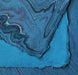 Hand marbled paper in shades of blue, showcasing unique patterns, created by The Casual Bookbinder for the Softcover Notebook.