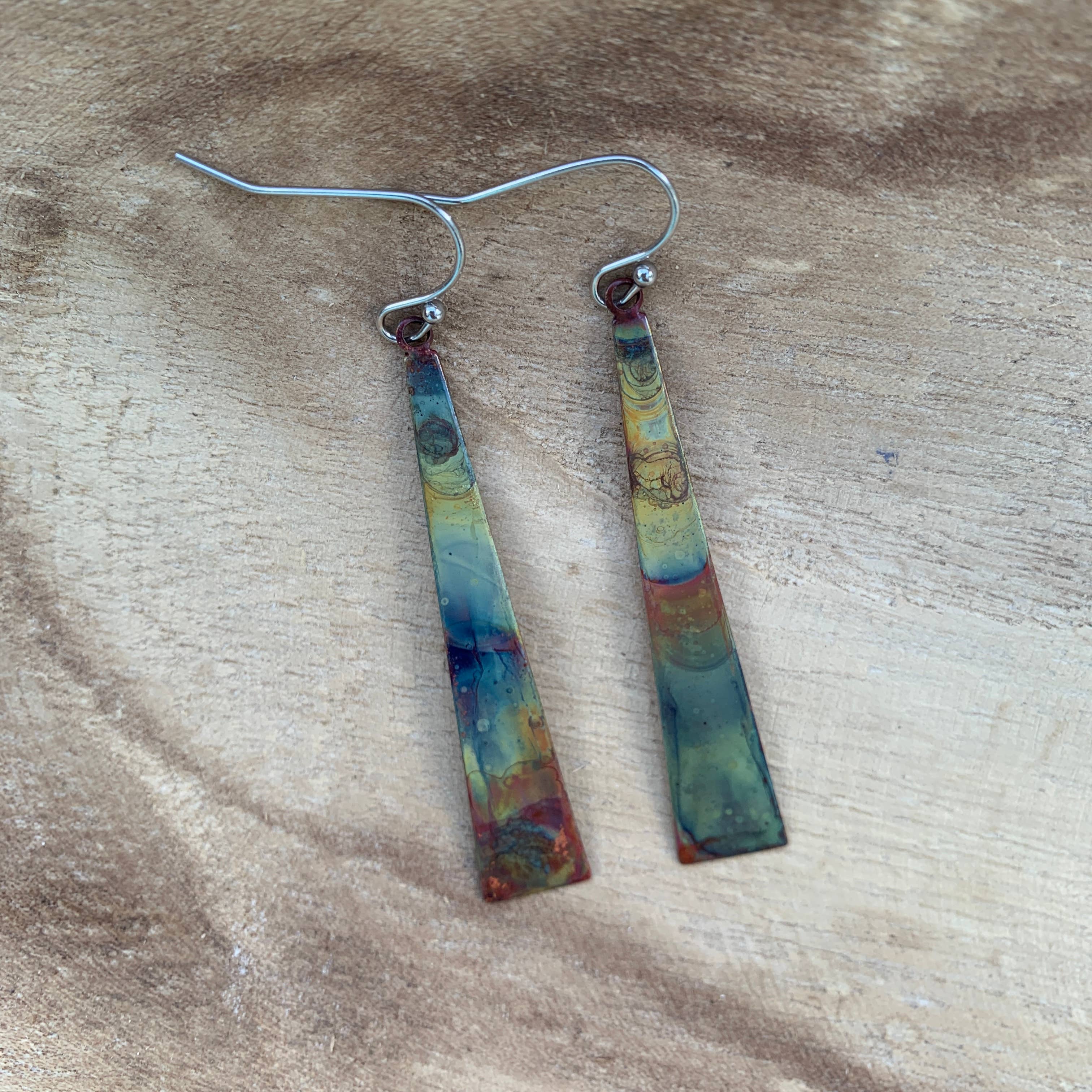 Triangle Stick Earrings displayed on a model, demonstrating their stylish look and versatility.