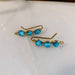 Kingman Turquoise Ear Climbers: the ultimate bling-bling for your lobes, making them dance with joy!