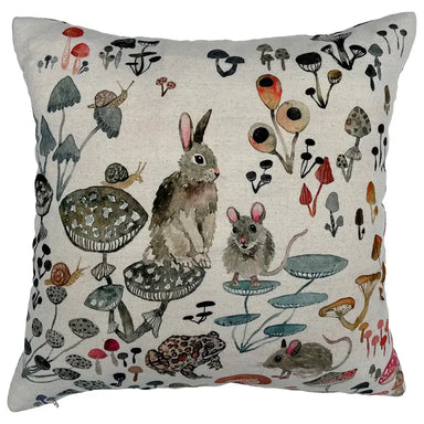 throw pillows with mushrooms, insects and small animals