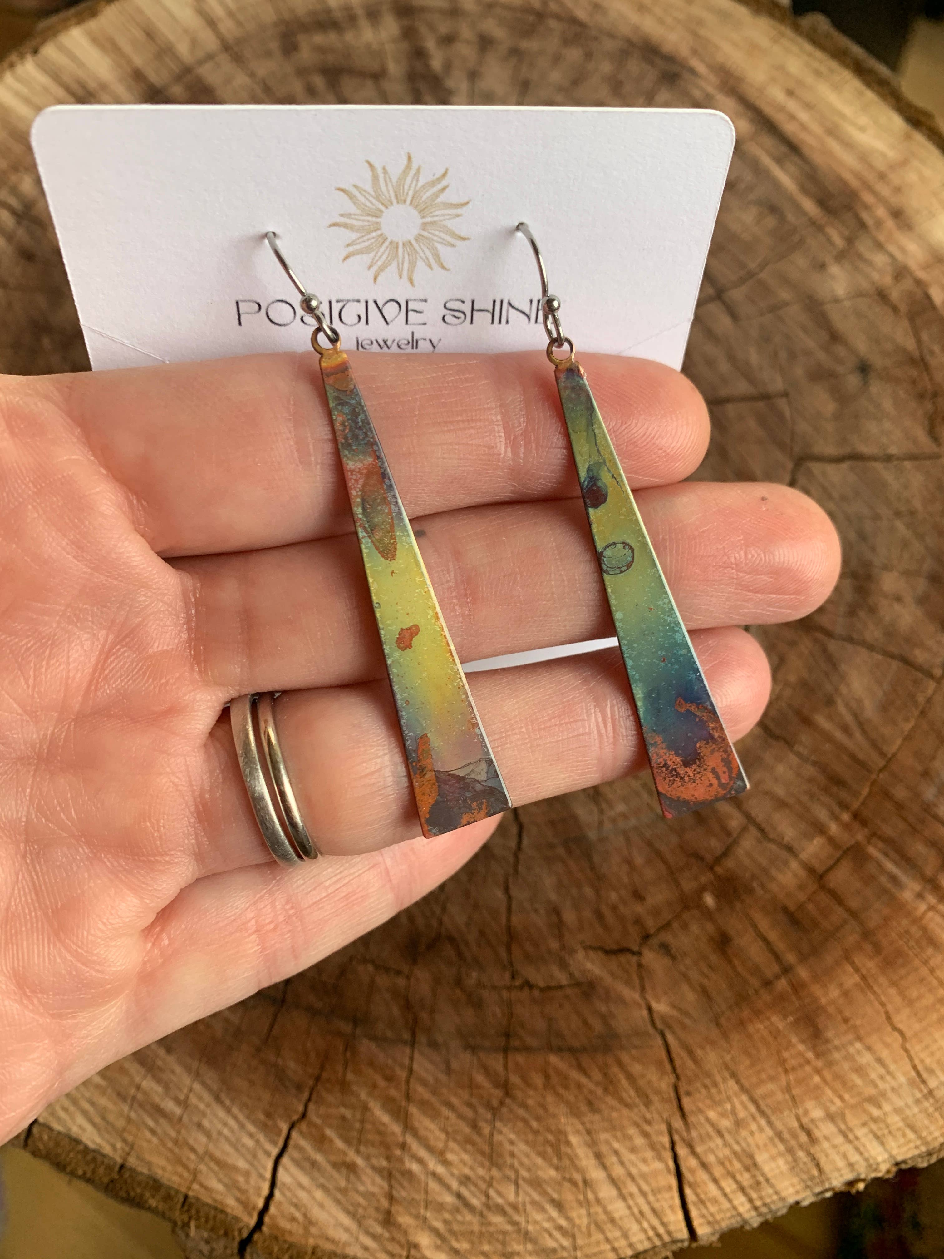 Triangle Stick Earrings showcasing their vibrant colors and unique design, perfect for any outfit by Positive Shine Jewelry.