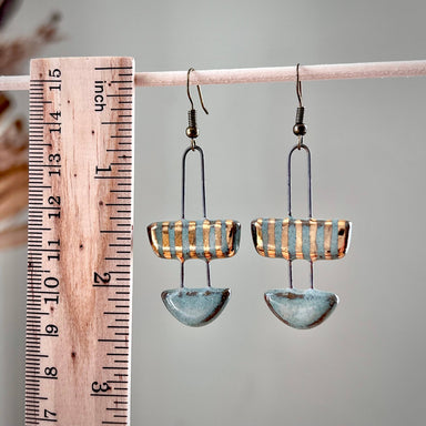 A radiant close-up of Turquoise Two Piece Striped Ceramic Clay Earrings, perfect for those days when you want your accessories to do the talking - let’s hope they don’t start a conversation!