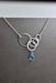 Aqua Eco Glass Sterling Silver Circle Necklace featuring a beautiful aqua Eco Glass teardrop pendant with a frosted finish and delicate sterling silver circles, ideal for eco-conscious fashion lovers.