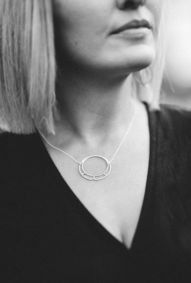 woman wearing Brass circle pendant necklace
