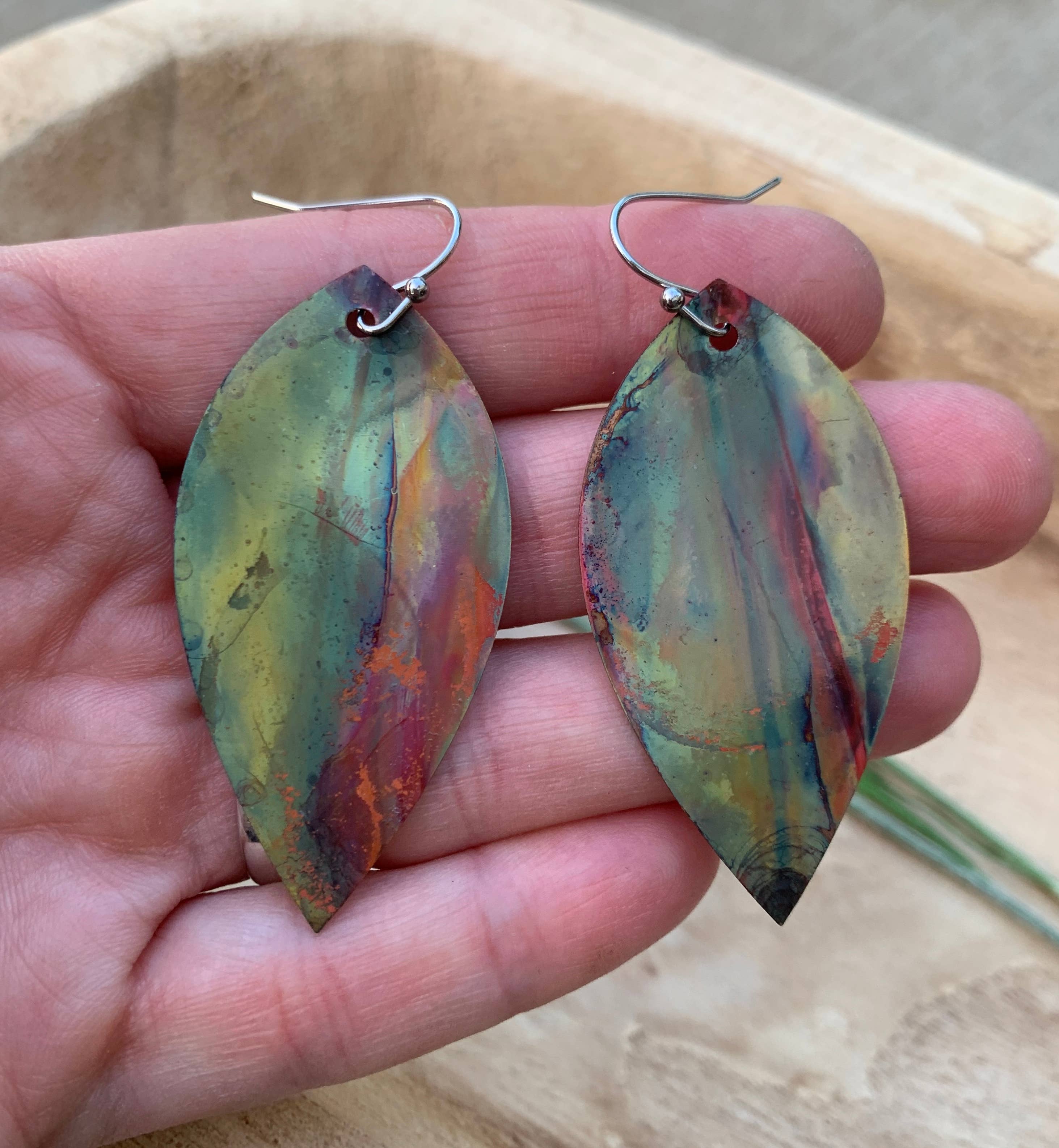 Elegant Botanical Large Leaf Fire Painted Copper Earrings on display, highlighting their lightweight design and stunning colors.