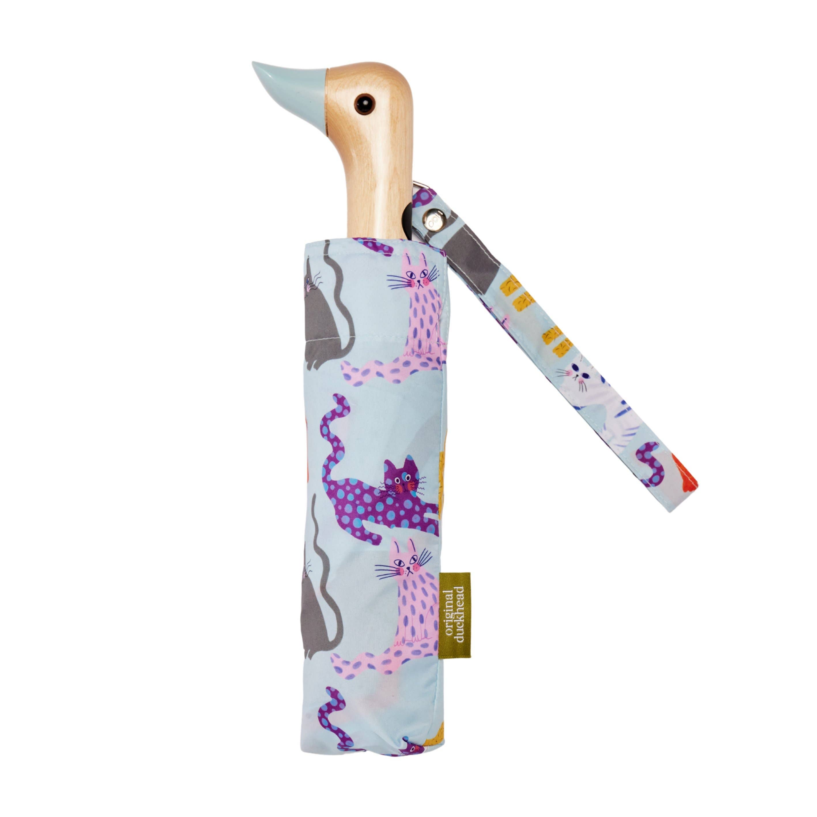 Arty Cats Duck Umbrella showcasing an ice blue cats pattern with a unique duck-head handle, made by Original Duckhead USA.
