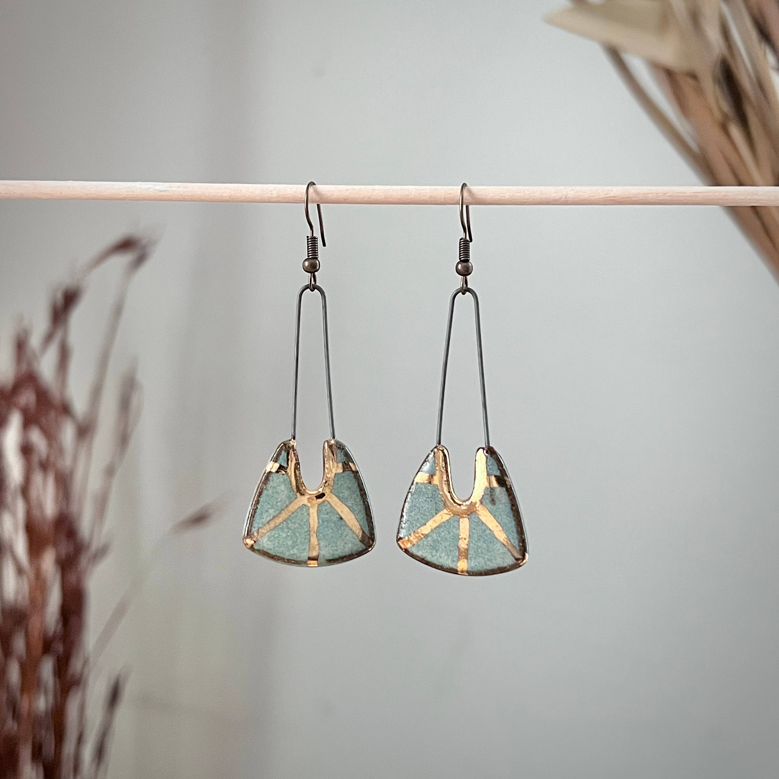 Turquoise Dropped Stoneware Earrings with Gold Sun Design