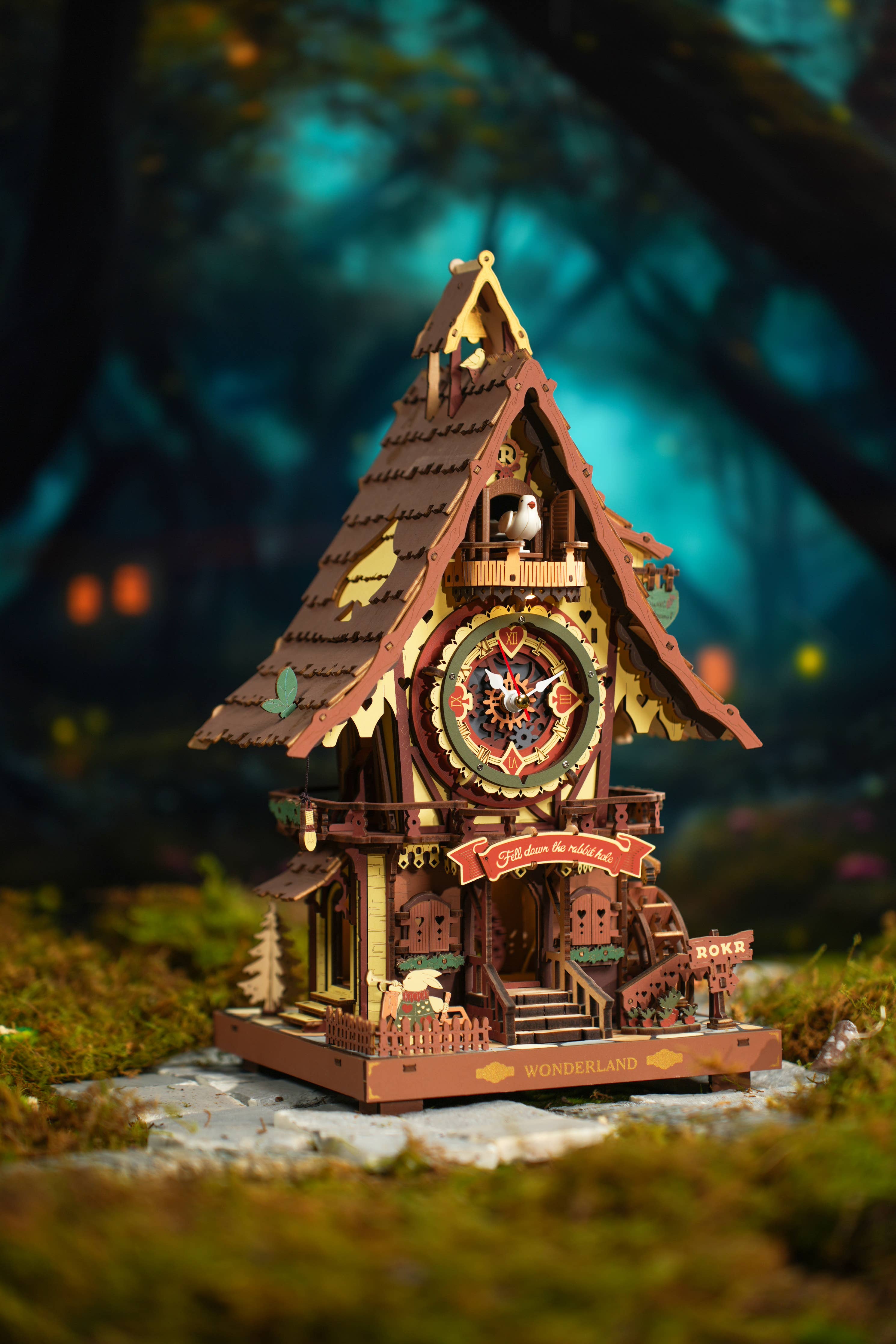 Cuckoo Clock DIY Wooden Puzzle by Hands Craft, showcasing a whimsical fairy tale cottage design, beautifully decorated with intricate details, surrounded by a mystical forest backdrop.