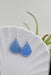 Close-up view of Eco Glass Bezel Drop Silver Earrings: Aqua highlighting the unique bezel design and vibrant color.