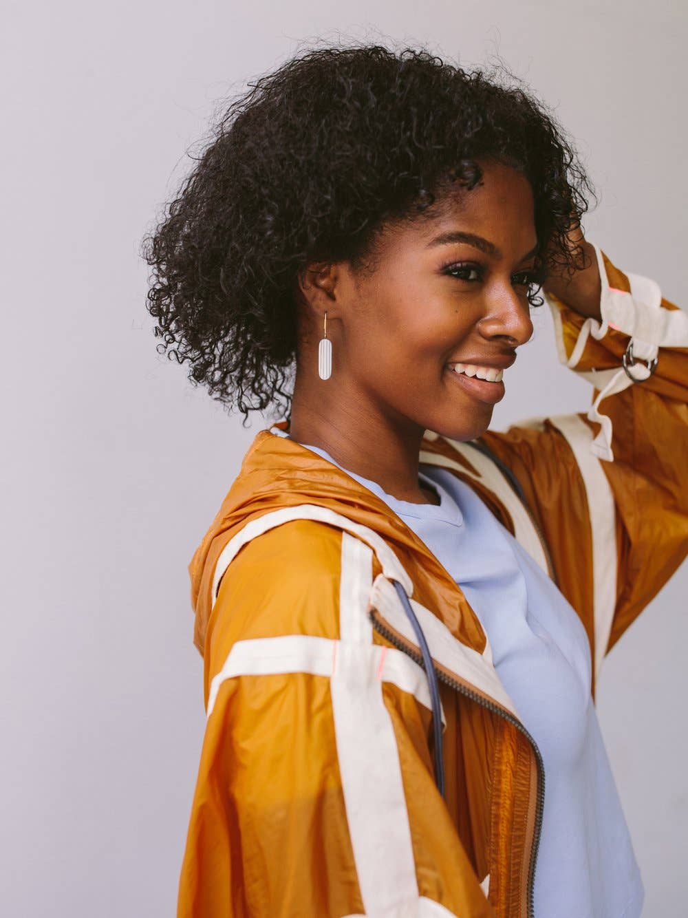 woman wearing glazed pinstripe earrings