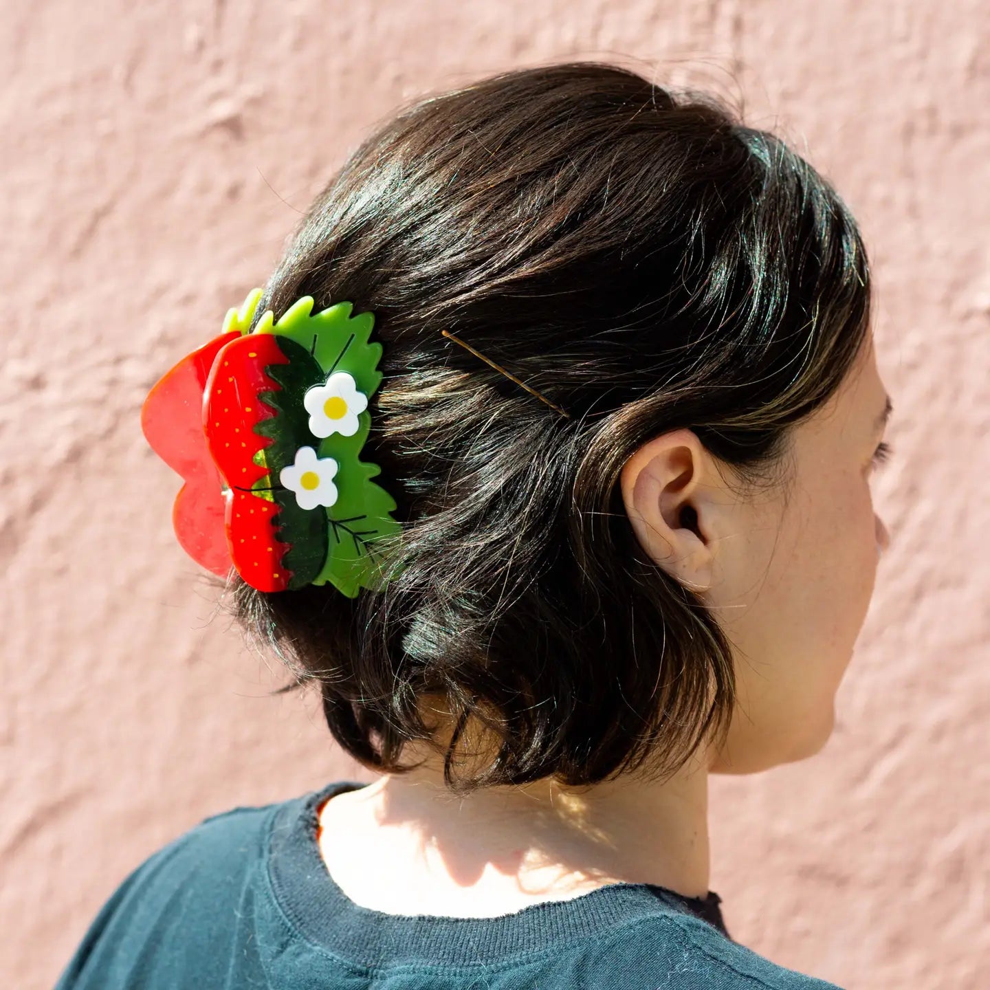 woman wearing Strawberry Hair accessory with teeth