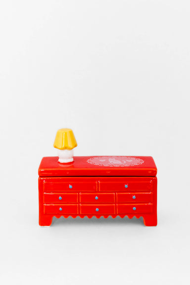 Whimsical Trinket Box by Ban.do featuring a tiny dresser with a 3D lamp, perfect for storing your little treasures and making you feel like a miniature dollhouse inhabitant.