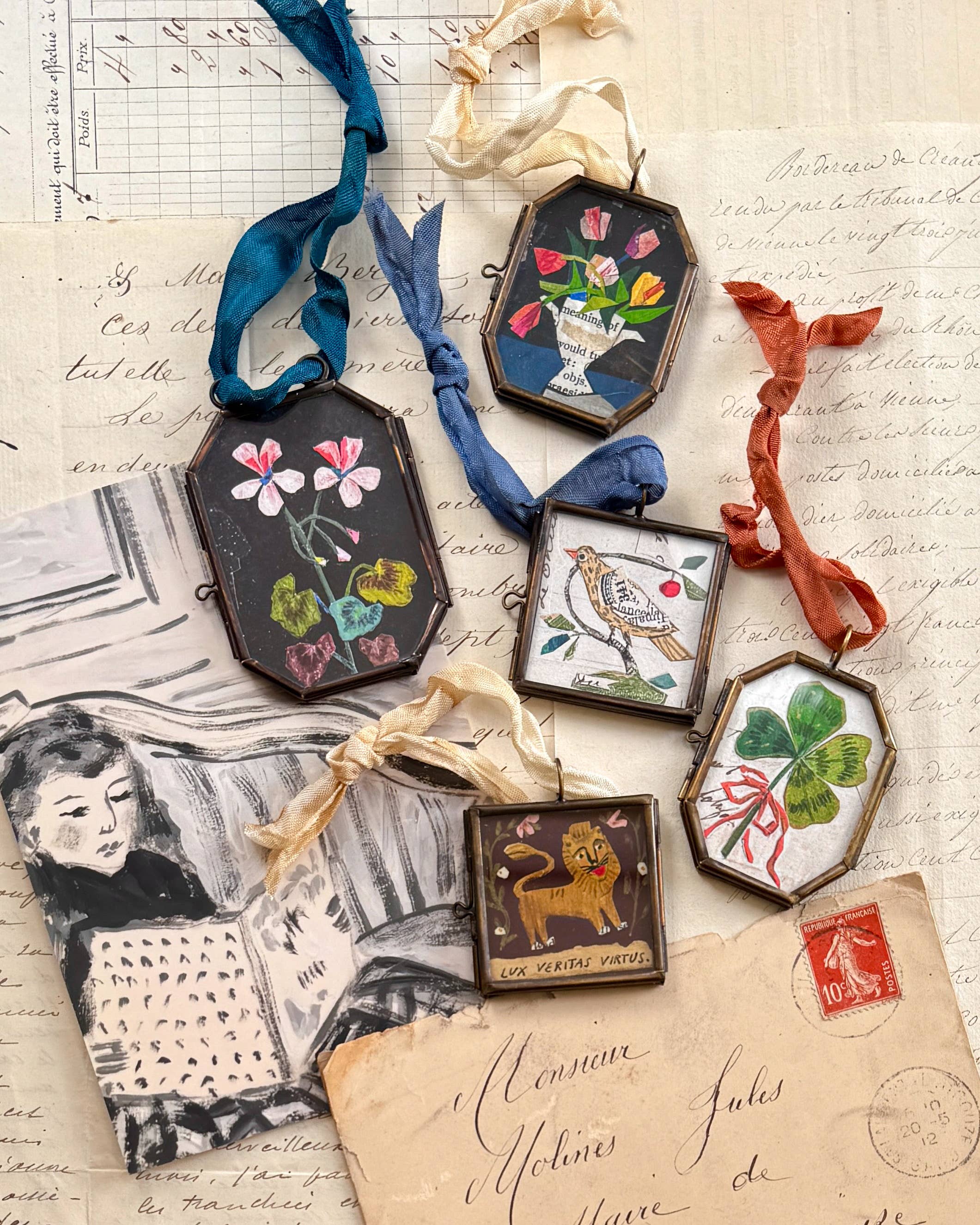 Vintage-style folk art locket ornaments.
