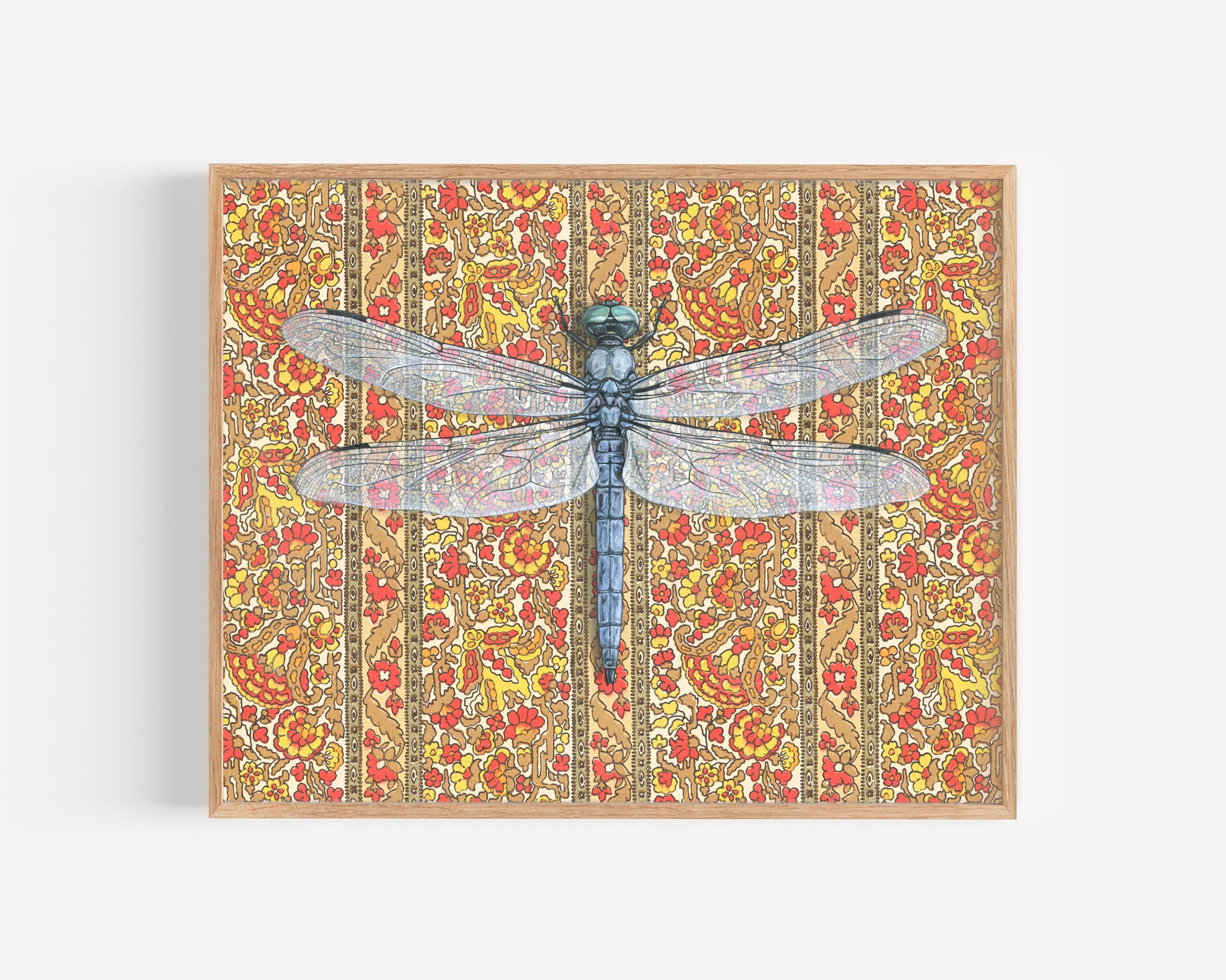 Framed art print of a dragonfly over a patterned floral background.