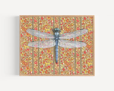 Framed art print of a dragonfly over a patterned floral background.