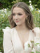 Budding Heart Earrings by Holly Yashi, featuring a romantic design with shimmering petals, curling vines, and a single pearl that whispers secrets of the garden. Perfect for those who want their ears to do the talking!