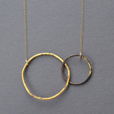 Interlocking Circles Necklace Steel & Gold - A striking mix of heavy gauge steel and 23k gold that’ll make other necklaces green with envy!