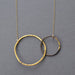 Interlocking Circles Necklace Steel & Gold - A striking mix of heavy gauge steel and 23k gold that’ll make other necklaces green with envy!