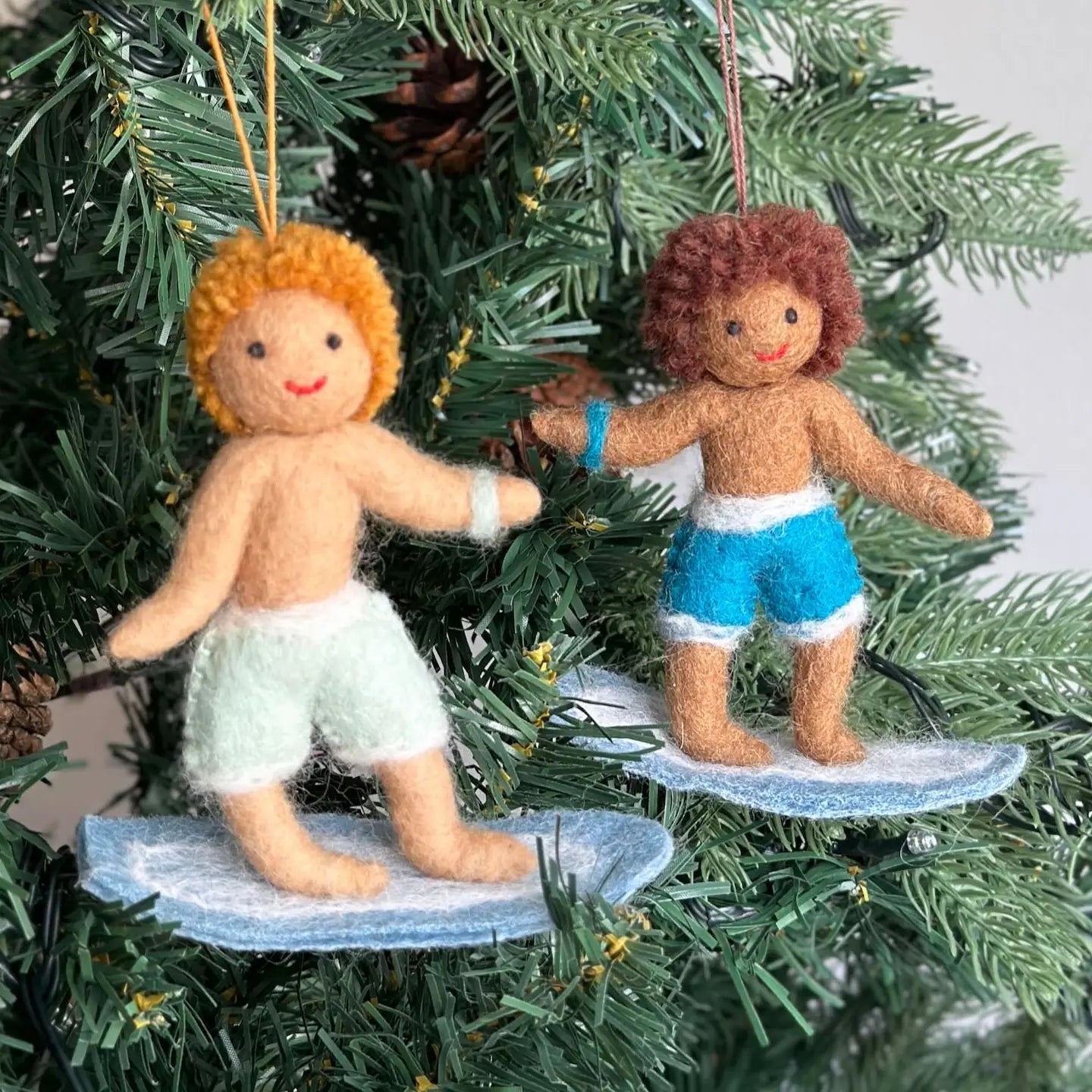 Cheerful Felt Surfer Ornaments featuring a surfer boy and girl in vibrant colors, celebrating summer and joy, perfect for holiday decor.