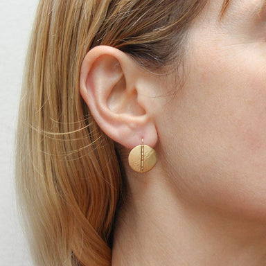 Close-up view of Small Medallion Wire Earrings highlighting the textural details of the hammered wire and petite size, perfect for everyday wear.