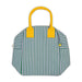 Green and white striped lunch bag with yellow handles
