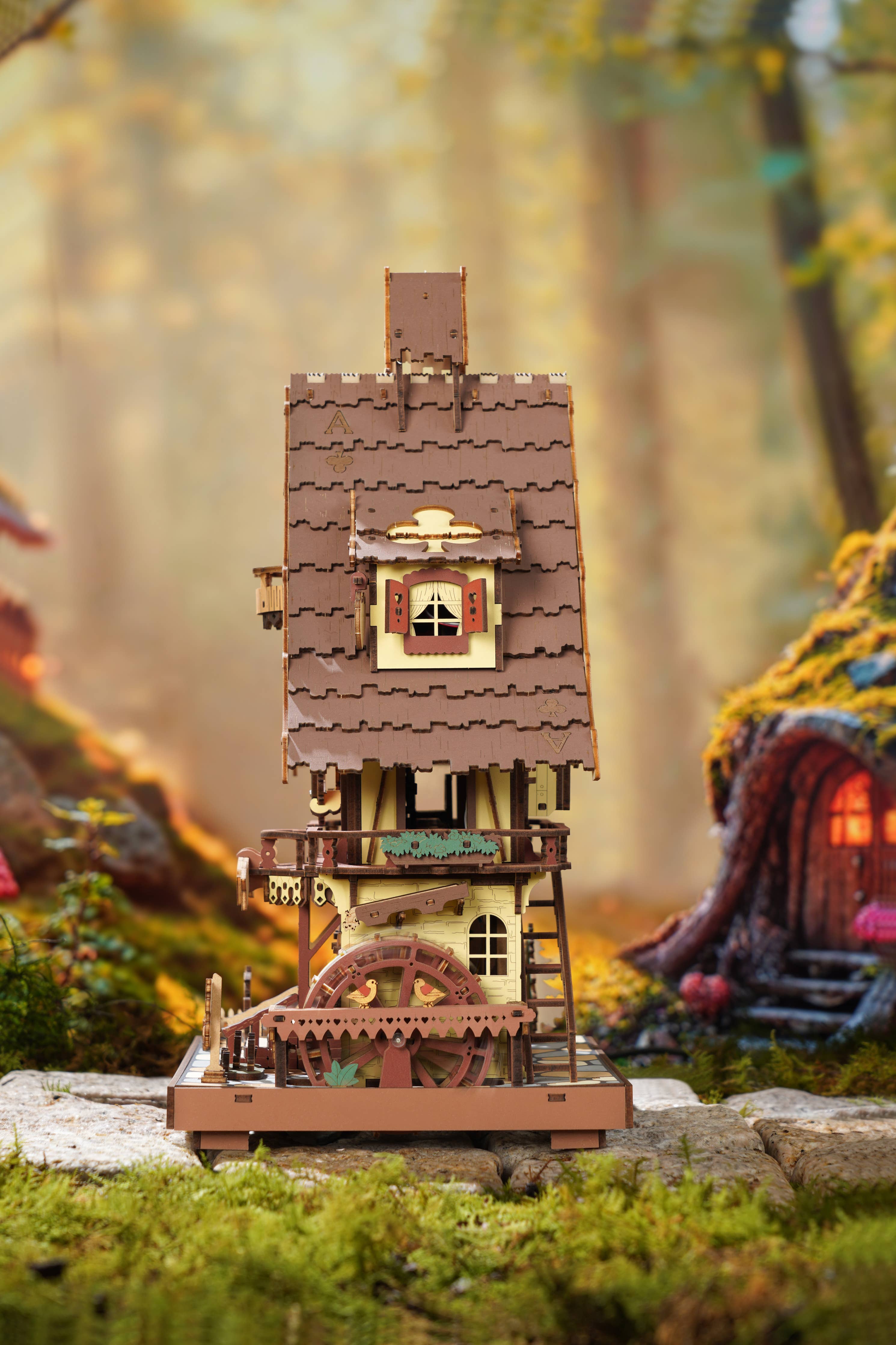 Side view of the Cuckoo Clock DIY Wooden Puzzle by Hands Craft, emphasizing the rustic architecture and creative design.