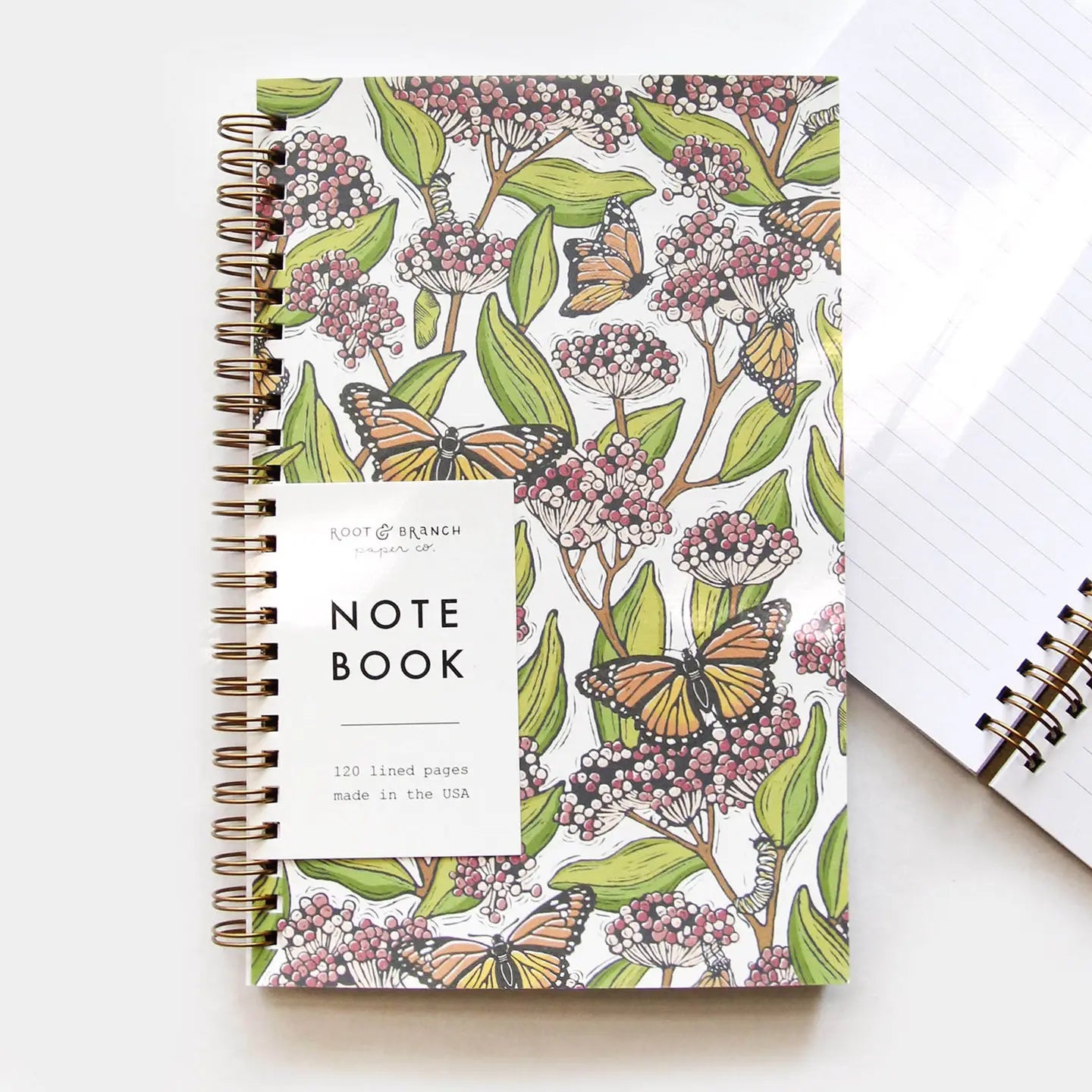 Inside view of Root & Branch Spiral Bound Notebooks showing thick 70lb lined pages, ideal for writing and note-taking.