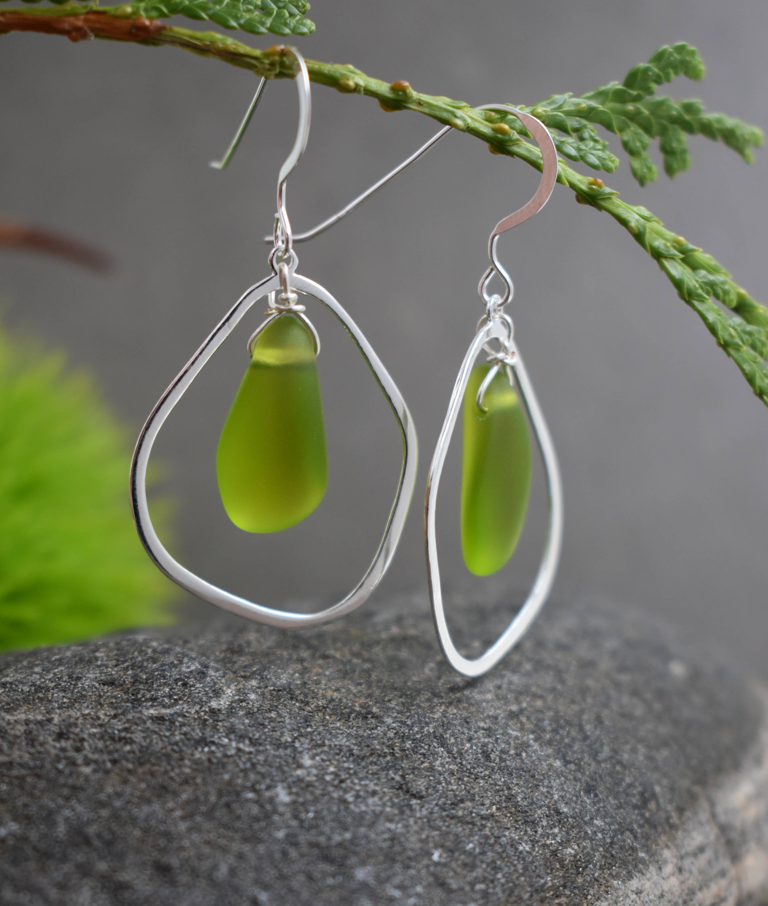 Elegant Green Eco Glass Teardrop Frame Earrings displayed beautifully, emphasizing their lightweight and stylish features.