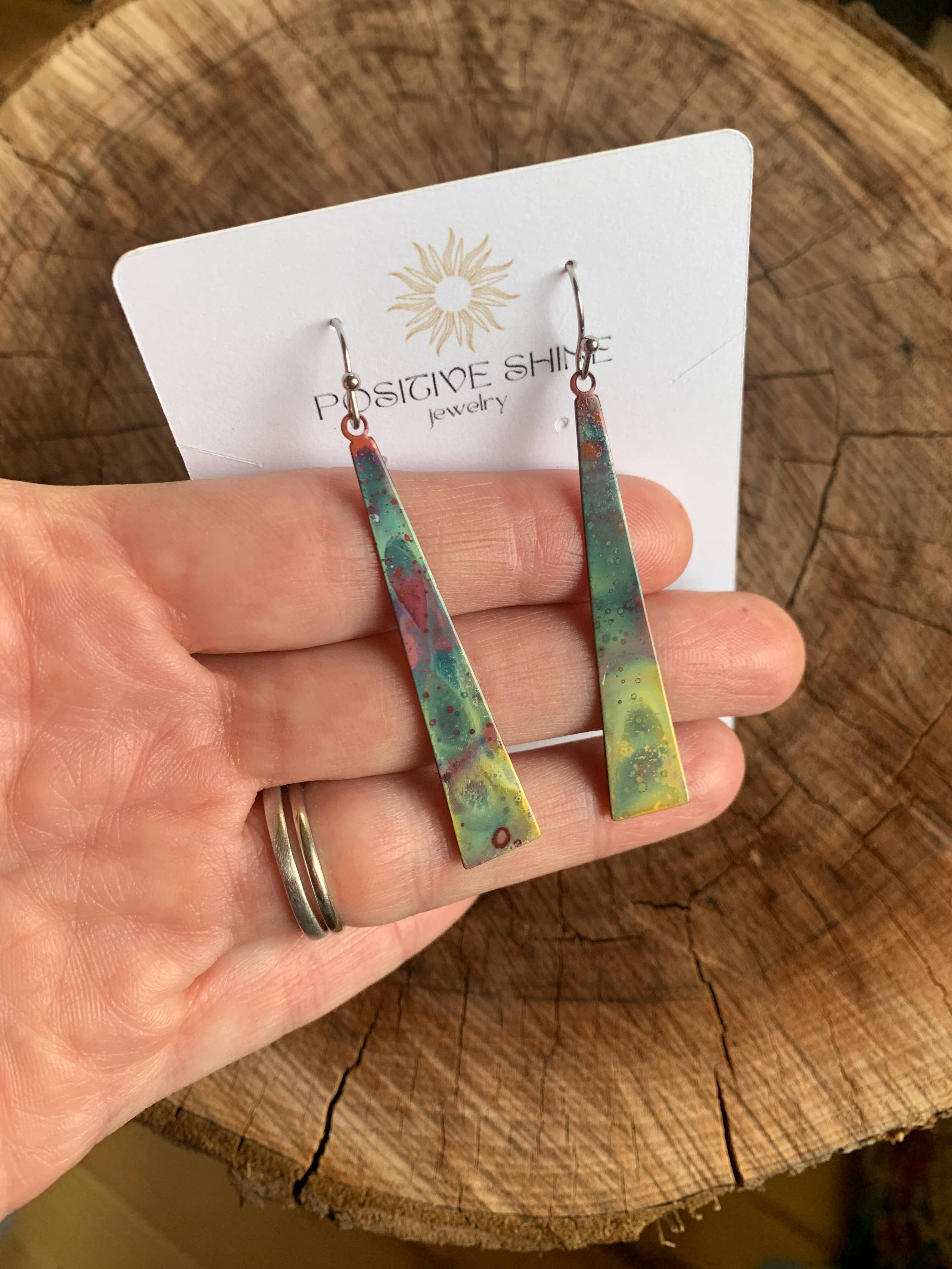 Close-up of Triangle Stick Earrings highlighting the craftsmanship and light weight, ideal for daily wear.