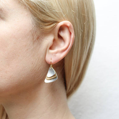 Close-up view of Small Layered and Dished Triangles Wire Earrings showcasing the subtle movement and elegant design of layered triangles in brass and silver.