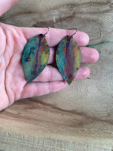 Close-up view of Botanical Large Leaf Fire Painted Copper Earrings showcasing the intricate details and unique artwork from heat treatment.