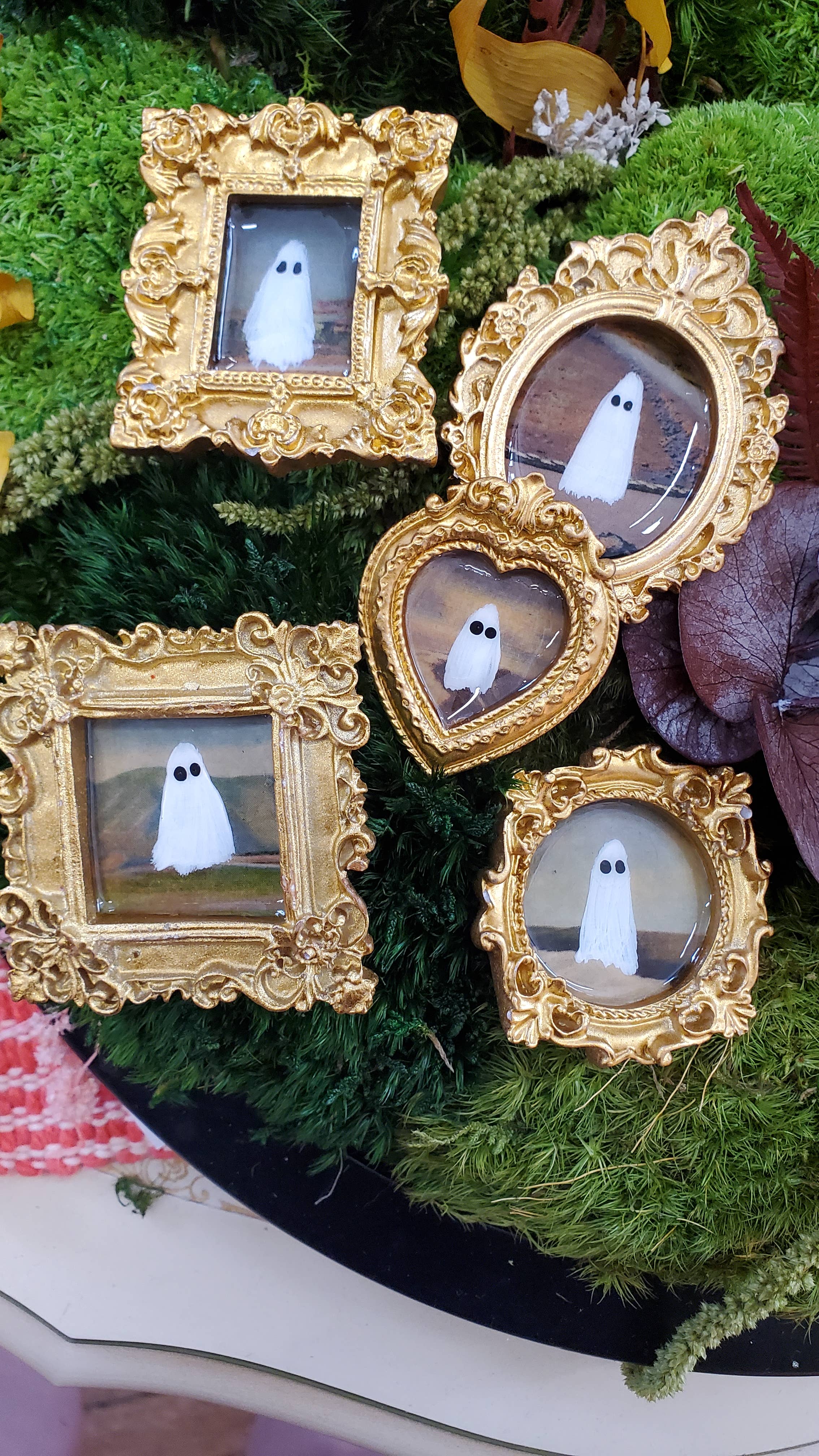 Ghosts on vacation in gold mini frames