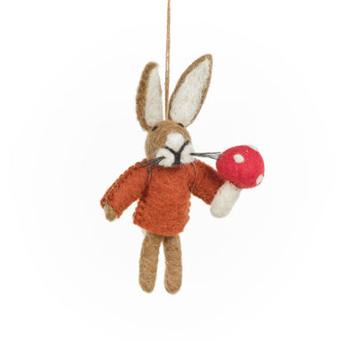 Felted rabbit ornament holding a red mushroom